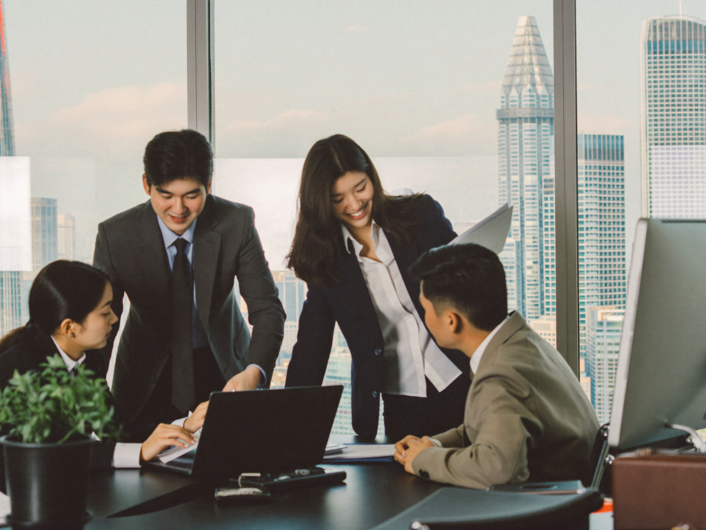 Investment banking graduate analysts collaborating in a London office